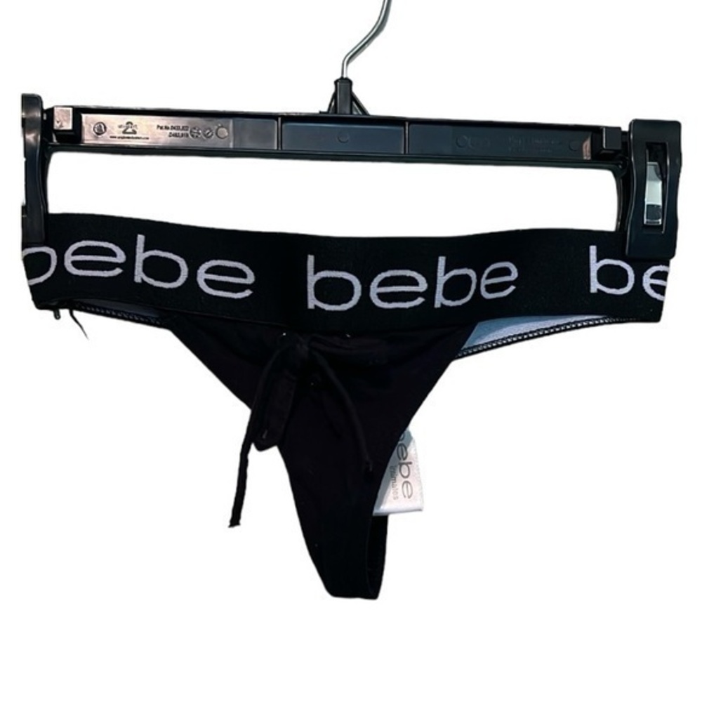 Bebe intimates thong black and white size medium. Tie front. never worn.